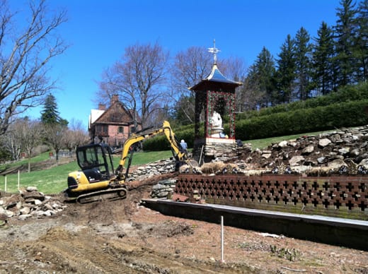 Restoration underway near Pavilion, with view to house Restoration underway near Pavilion, with view to house this