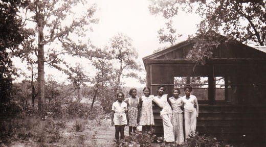 African American girls by a cabin at Lake Murray State Park 1939